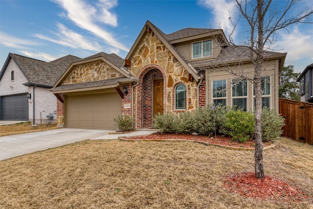 view of front of house featuring a garage and a front lawn