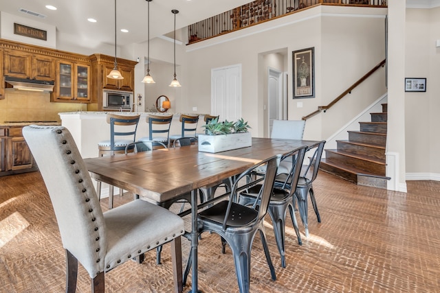 dining room featuring a high ceiling