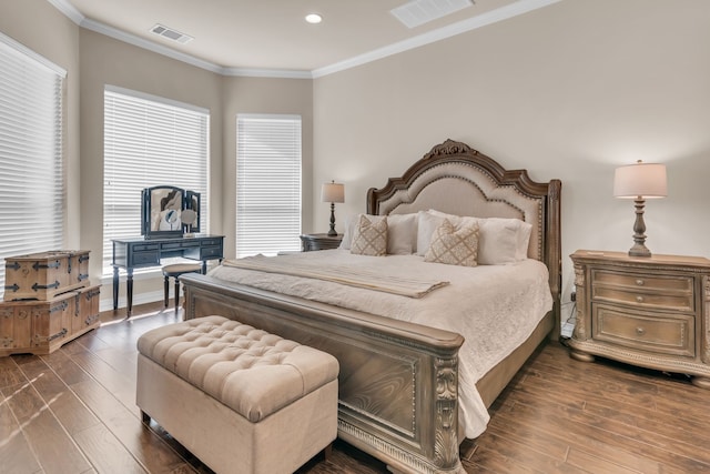 bedroom featuring crown molding and dark hardwood / wood-style flooring