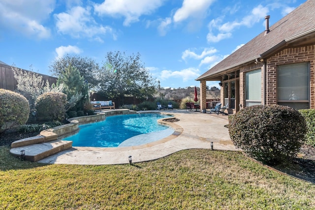 view of swimming pool featuring a yard, a patio, and pool water feature