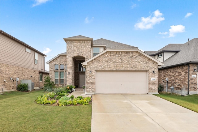 view of front of property with an attached garage, driveway, a front yard, and brick siding