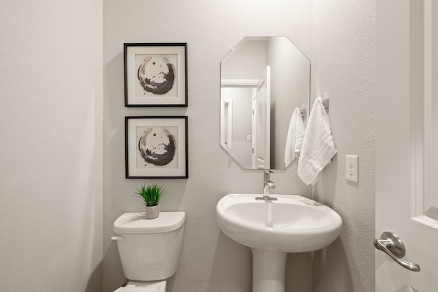 1504 Longspur Dr, Argyle, TX 76226 - half bathroom with toilet and a textured wall