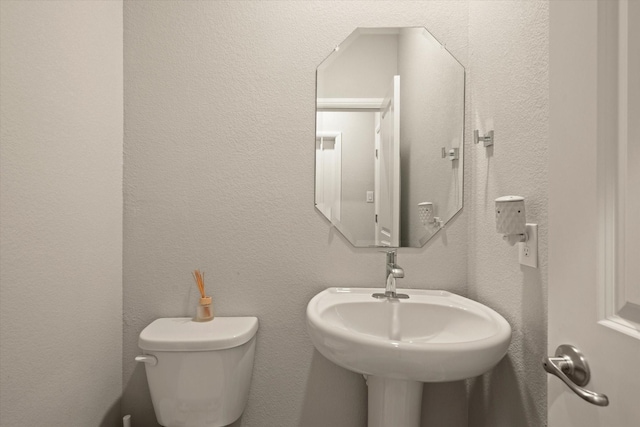 bathroom with sink and toilet