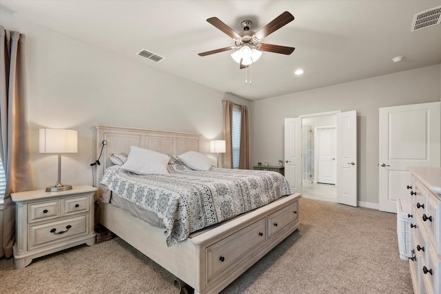 bedroom featuring ceiling fan and light colored carpet