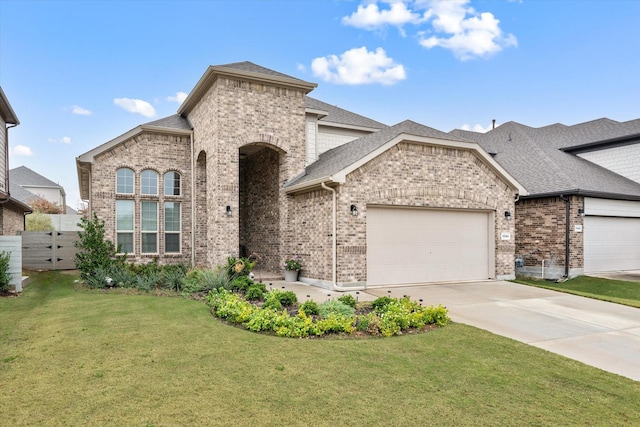 french provincial home featuring concrete driveway, brick siding, and an attached garage