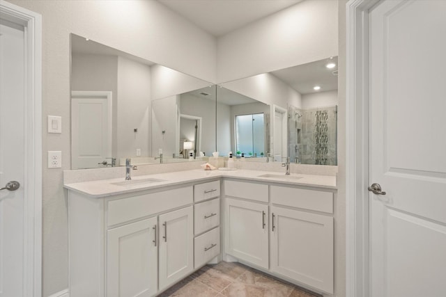 bathroom featuring vanity and a shower with shower door