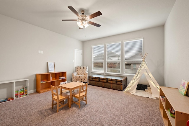 playroom with carpet and ceiling fan