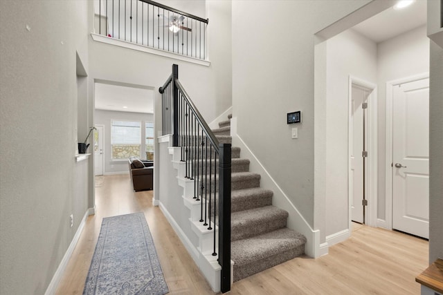 1504 Longspur Dr, Argyle, TX 76226 - staircase with wood finished floors, baseboards, and a towering ceiling