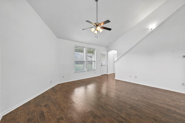 unfurnished living room featuring high vaulted ceiling, ceiling fan, and dark wood-type flooring