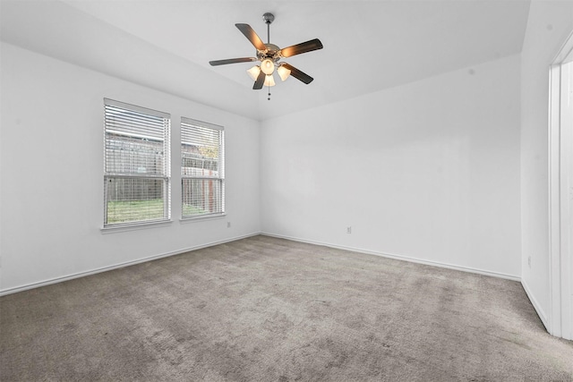 empty room featuring carpet flooring and ceiling fan