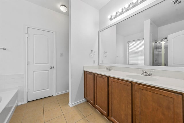 bathroom with plus walk in shower, vanity, and tile patterned floors