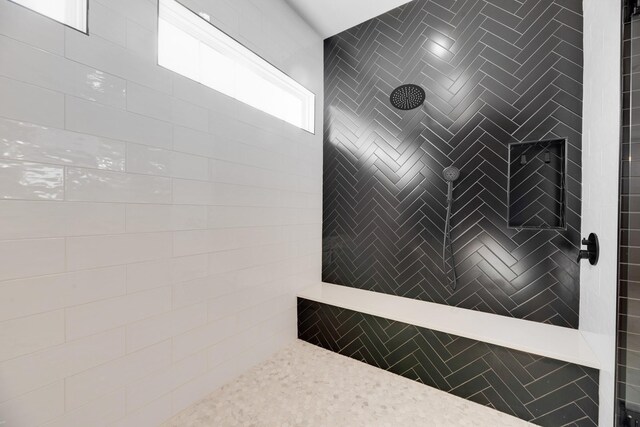 bathroom featuring tiled shower