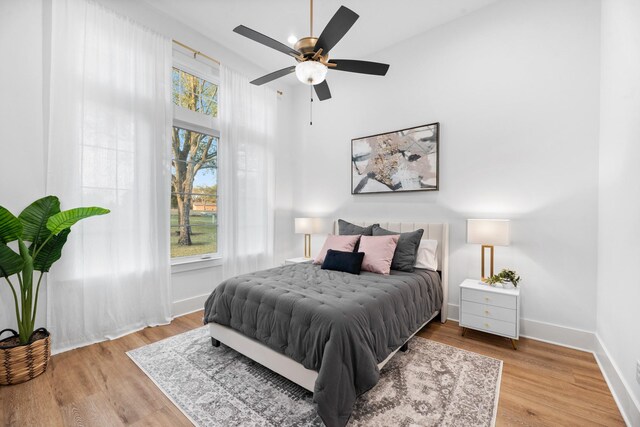 bedroom featuring ceiling fan and wood-type flooring