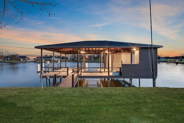 dock area featuring a water view and a yard