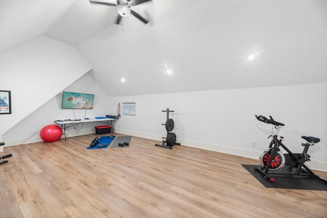 workout room featuring ceiling fan, vaulted ceiling, and light hardwood / wood-style floors