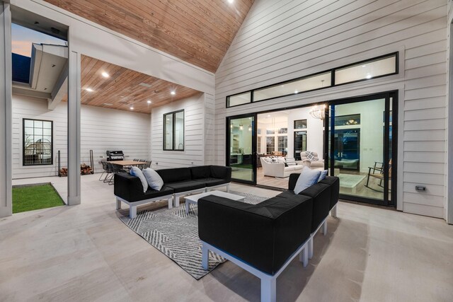 living room featuring high vaulted ceiling, wood ceiling, an inviting chandelier, and wood walls