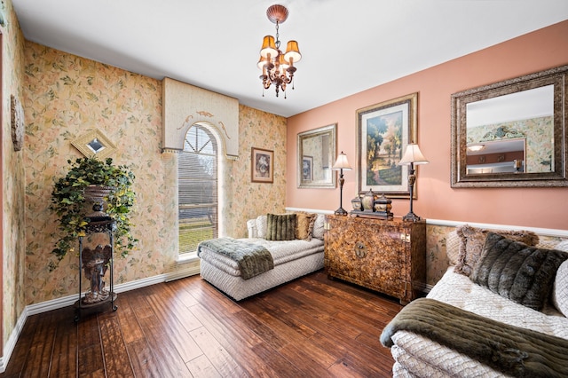 living room featuring hardwood / wood-style floors and a notable chandelier