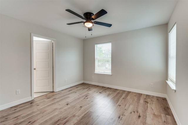 spare room with ceiling fan and light hardwood / wood-style flooring