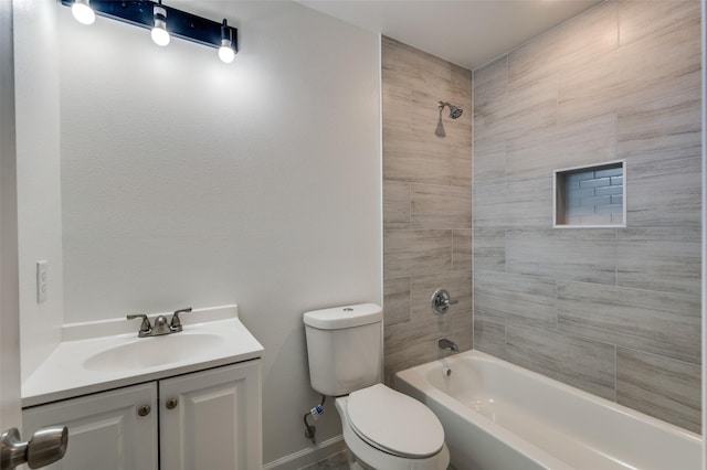 full bathroom with toilet, vanity, and tiled shower / bath combo