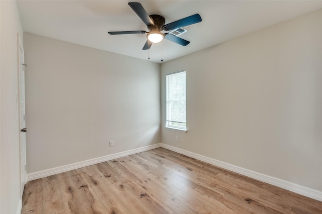 empty room with ceiling fan and light wood-type flooring