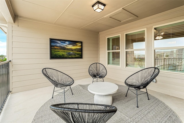 view of patio featuring a balcony