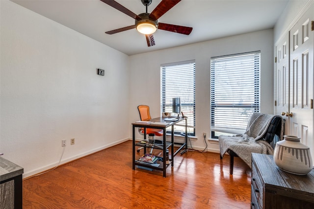 home office with ceiling fan and hardwood / wood-style flooring