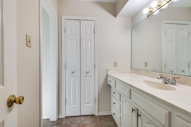 2504 Kingsridge Dr, Dallas, TX 75287 - bathroom with a closet, vanity, and baseboards