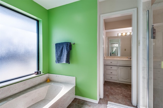 2504 Kingsridge Dr, Dallas, TX 75287 - bathroom with a stall shower, vanity, a garden tub, tile patterned floors, and baseboards