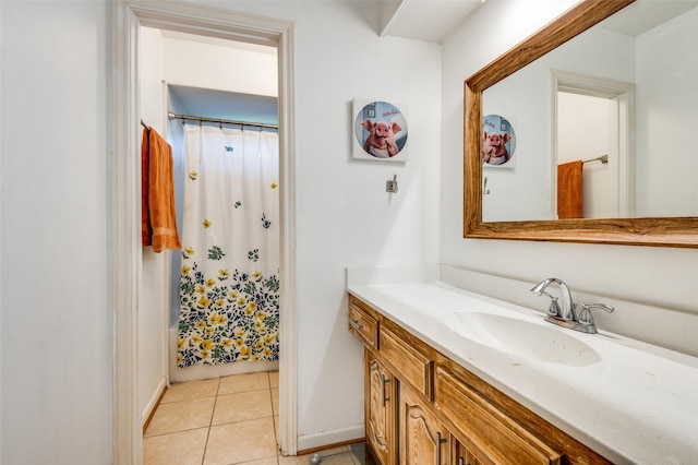 bathroom with tile patterned floors and vanity