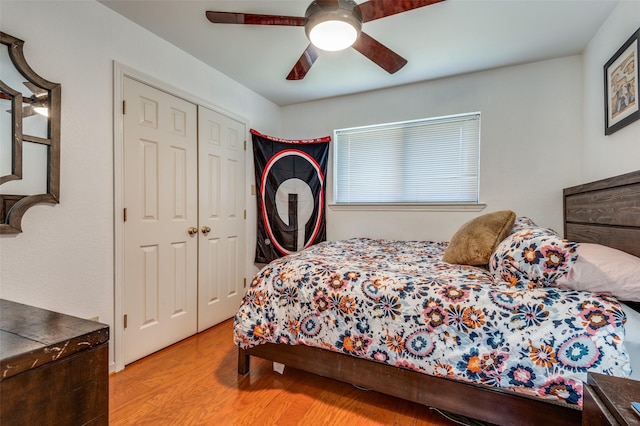 2504 Kingsridge Dr, Dallas, TX 75287 - bedroom with wood finished floors, ceiling fan, and a closet