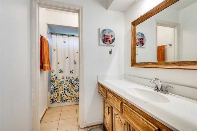 2504 Kingsridge Dr, Dallas, TX 75287 - bathroom featuring vanity, tile patterned flooring, a shower with curtain, and baseboards