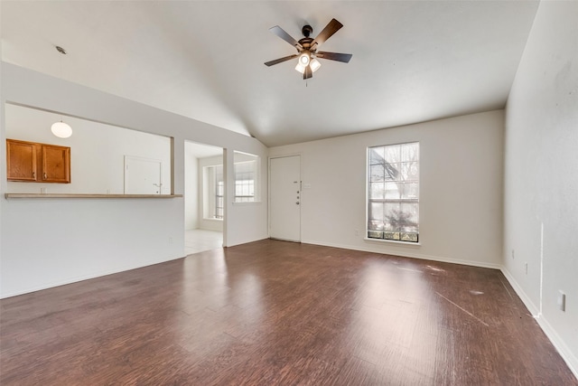 unfurnished living room with lofted ceiling, hardwood / wood-style flooring, and ceiling fan