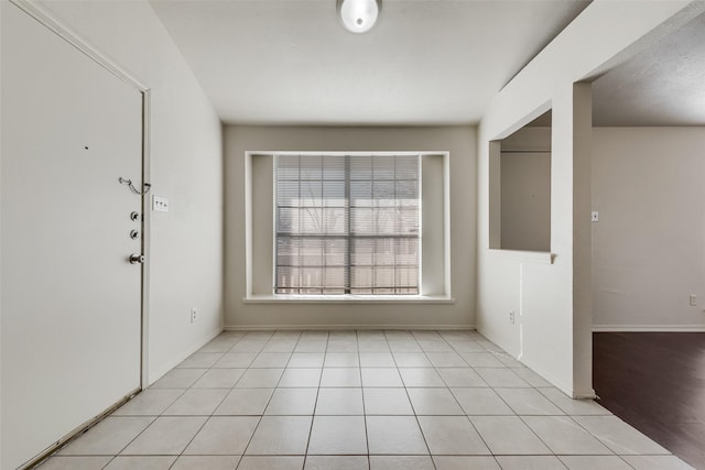 entrance foyer featuring light tile patterned floors