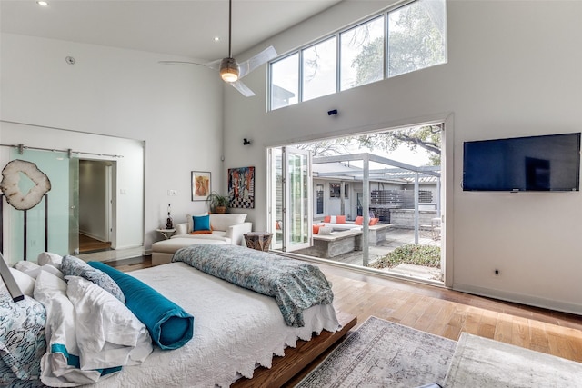 4165 Meadowdale Ln, Dallas, TX 75229 - bedroom with access to outside, a ceiling fan, wood finished floors, and a high ceiling