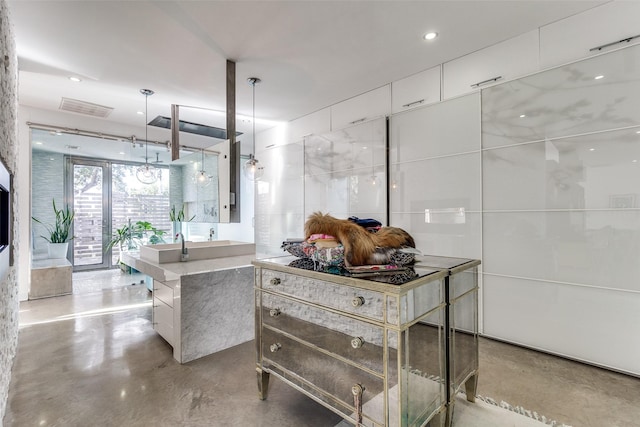 4165 Meadowdale Ln, Dallas, TX 75229 - bathroom featuring vanity, recessed lighting, and finished concrete floors