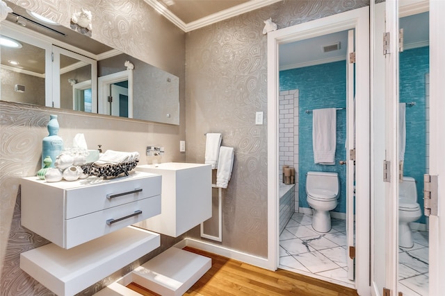 bathroom featuring hardwood / wood-style floors, vanity, toilet, and crown molding