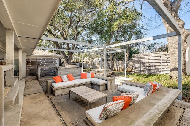 view of patio / terrace with an outdoor living space and a pergola