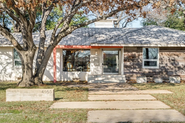 4165 Meadowdale Ln, Dallas, TX 75229 - view of front of house featuring a shingled roof, a front lawn, and a chimney