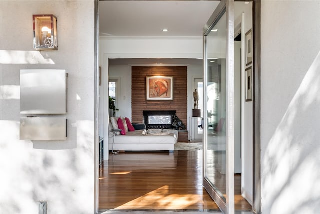 corridor featuring crown molding and hardwood / wood-style flooring