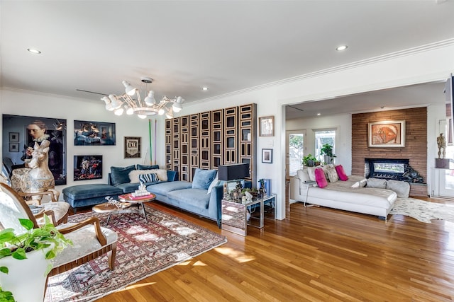 4165 Meadowdale Ln, Dallas, TX 75229 - living area featuring an inviting chandelier, light wood-style flooring, a multi sided fireplace, recessed lighting, and ornamental molding