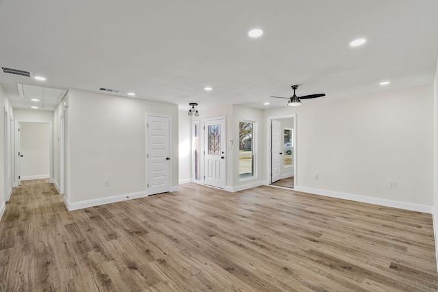 spare room with ceiling fan and light hardwood / wood-style floors