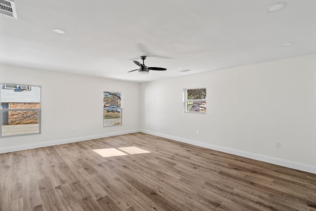 unfurnished room featuring ceiling fan and light hardwood / wood-style flooring