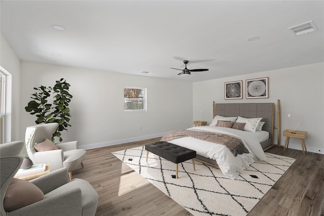 bedroom featuring ceiling fan and hardwood / wood-style floors