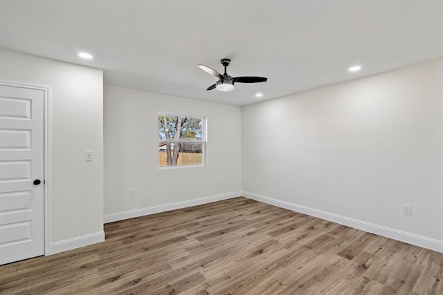 unfurnished room featuring light hardwood / wood-style floors and ceiling fan