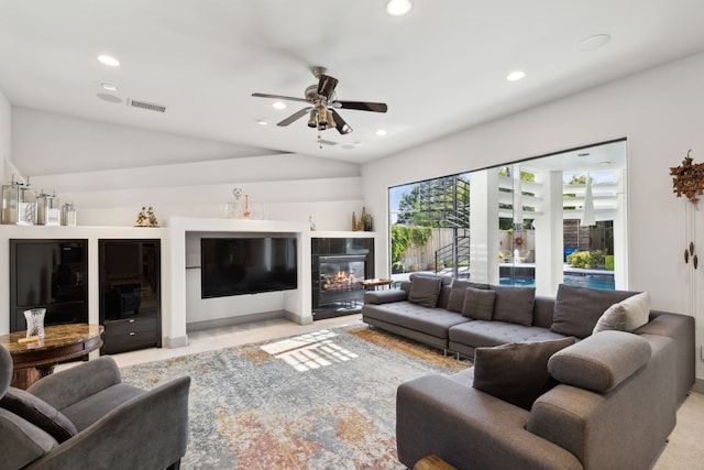 living room with vaulted ceiling and ceiling fan