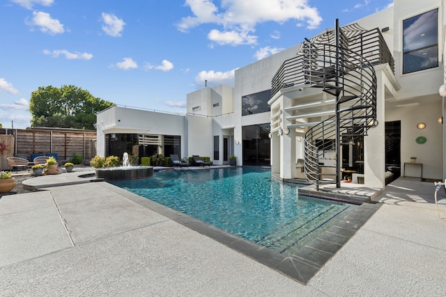 view of swimming pool featuring a patio