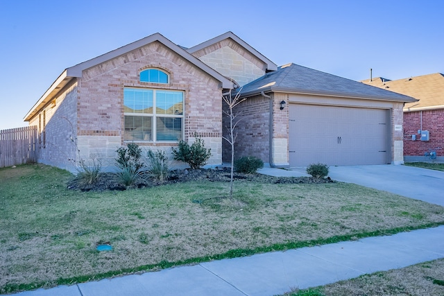 single story home with a garage and a front yard