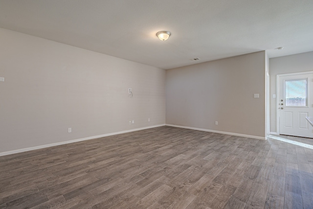 empty room featuring hardwood / wood-style flooring