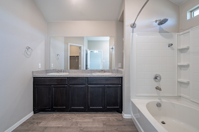 bathroom with bathtub / shower combination and vanity