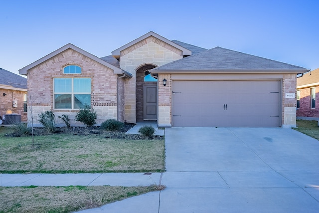 single story home with a front lawn and a garage